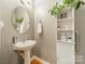 Convenient half bathroom with pedestal sink at 10126 Loch Lomond Dr, Charlotte, NC 28278