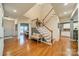 Spacious entryway with hardwood floors and a staircase leading upstairs at 10126 Loch Lomond Dr, Charlotte, NC 28278