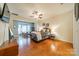 Spacious primary bedroom with hardwood floors and sitting area at 10126 Loch Lomond Dr, Charlotte, NC 28278