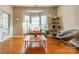 Bright living room with bay window and cozy seating area at 10126 Loch Lomond Dr, Charlotte, NC 28278