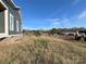 Gray house exterior with a partially finished wooden deck and surrounding land at 1517 Sugarfarm Rd, Catawba, NC 28609