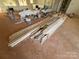 Stack of unfinished wood baseboards on the floor of a room under construction at 1517 Sugarfarm Rd, Catawba, NC 28609