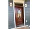 A new home's dark brown front door with oval glass detail is partially open at 1517 Sugarfarm Rd, Catawba, NC 28609