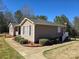 Tan ranch home with a red door and side walkway at 1627 Peden Bridge Rd, Chester, SC 29706