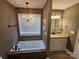 Bathroom features a jetted tub and updated vanity at 1627 Peden Bridge Rd, Chester, SC 29706