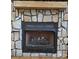 Stone fireplace with gas logs in living room at 1627 Peden Bridge Rd, Chester, SC 29706