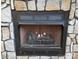 Cozy stone fireplace with a gas log insert at 1627 Peden Bridge Rd, Chester, SC 29706