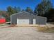 Gray metal workshop with large garage door at 1627 Peden Bridge Rd, Chester, SC 29706