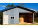 Metal building exterior with garage door and hay bale at 1627 Peden Bridge Rd, Chester, SC 29706