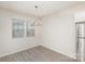 Bright dining room features hardwood floors and a modern light fixture at 2410 Via Dei Conte Aly, Charlotte, NC 28205