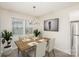 Dining room with wood table, chairs, and chandelier at 2410 Via Dei Conte Aly, Charlotte, NC 28205