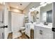 Bathroom with double vanity, shower, and white cabinets at 530 Denton Ave, Chester, SC 29706