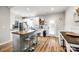 Eat-in kitchen with island, hardwood floors, and white cabinets at 530 Denton Ave, Chester, SC 29706