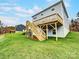 Two-story home with a deck and stairs leading to a grassy backyard at 14415 Autumncrest Rd # 2, Huntersville, NC 28078
