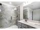 Bathroom with walk-in shower, grey tile, and double vanity at 14415 Autumncrest Rd # 2, Huntersville, NC 28078