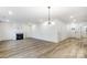 Spacious living room with hardwood floors, fireplace, and recessed lighting at 14415 Autumncrest Rd # 2, Huntersville, NC 28078
