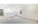 Spacious loft area with carpeted floor and natural light at 14415 Autumncrest Rd # 2, Huntersville, NC 28078