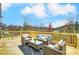 Spacious deck with seating area and scenic wooded views at 14421 Autumncrest Rd # 3, Huntersville, NC 28078