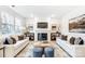 Open living area with hardwood floors, fireplace, and stylish decor at 14421 Autumncrest Rd # 3, Huntersville, NC 28078