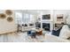 Spacious living room with fireplace, hardwood floors, and ample natural light at 14421 Autumncrest Rd # 3, Huntersville, NC 28078