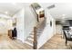 Elegant staircase with a modern wooden railing and dark metal spindles at 14421 Autumncrest Rd # 3, Huntersville, NC 28078
