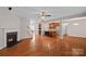 Gathering room with hardwood floors, fireplace and kitchen view at 16803 Rudence Ct, Charlotte, NC 28278