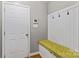 Convenient laundry room with built-in bench, storage, and washer/dryer hookups at 169 Rimmer Farm Rd, Troutman, NC 28166