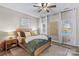 Bright bedroom with lake views, ceiling fan, and neutral decor at 169 Rimmer Farm Rd, Troutman, NC 28166