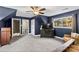 Blue-walled bedroom with two windows and a ceiling fan at 169 Rimmer Farm Rd, Troutman, NC 28166