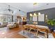 Open living room and kitchen with hardwood floors, vaulted ceiling, and ample natural light at 169 Rimmer Farm Rd, Troutman, NC 28166