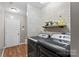 Updated laundry room with stylish chevron backsplash and modern washer and dryer at 169 Rimmer Farm Rd, Troutman, NC 28166