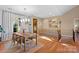 Elegant dining area with hardwood floors, chandelier, and access to upper level at 169 Rimmer Farm Rd, Troutman, NC 28166