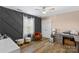 Home office with dark gray accent wall and hardwood floors at 169 Rimmer Farm Rd, Troutman, NC 28166