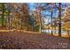 Peaceful backyard scene featuring a firepit and scenic lake view at 169 Rimmer Farm Rd, Troutman, NC 28166