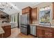 Kitchen boasts granite countertops, stainless steel appliances, and ample cabinet space at 169 Rimmer Farm Rd, Troutman, NC 28166