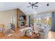 Spacious living room features a stone fireplace, hardwood floors, and large windows with scenic views at 169 Rimmer Farm Rd, Troutman, NC 28166