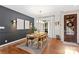 Bright dining room features a wood table, hardwood floors, and stylish wall decor at 169 Rimmer Farm Rd, Troutman, NC 28166