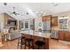 Open kitchen with granite island, stainless steel appliances, and views into the living room at 169 Rimmer Farm Rd, Troutman, NC 28166