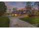 Beautiful lakefront home with a large driveway and attached garage at 169 Rimmer Farm Rd, Troutman, NC 28166