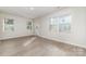 Bright living room with wood flooring and access to a patio at 2304 Via Dei Conte Aly, Charlotte, NC 28205