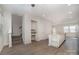 Open living area with kitchen island and stairs to upper level at 2304 Via Dei Conte Aly, Charlotte, NC 28205
