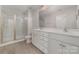 Double vanity bathroom with large shower and white cabinets at 2304 Via Dei Conte Aly, Charlotte, NC 28205