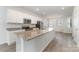 Modern kitchen with white cabinets, granite counters, and island at 2304 Via Dei Conte Aly, Charlotte, NC 28205