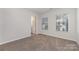 Well-lit bedroom featuring carpet and an attached bathroom at 2304 Via Dei Conte Aly, Charlotte, NC 28205