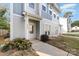Townhome exterior featuring gray siding, walkway, and landscaping at 2304 Via Dei Conte Aly, Charlotte, NC 28205