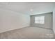 Spacious bedroom with neutral walls and carpeting at 2525 Crimson Way, Monroe, NC 28112