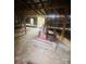 Barn interior with large stone grinding wheel at 2818 Rockford Rd, Shelby, NC 28152