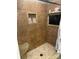 Large walk-in shower with built-in shelving and a TV at 2818 Rockford Rd, Shelby, NC 28152