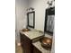 Bathroom with double sinks, granite countertops and wooden cabinets at 2818 Rockford Rd, Shelby, NC 28152