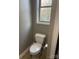 Small bathroom with a toilet and single sink at 2818 Rockford Rd, Shelby, NC 28152